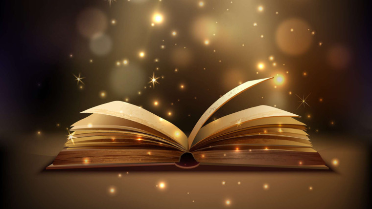 An open book with glowing light and sparkling particles rising from its pages