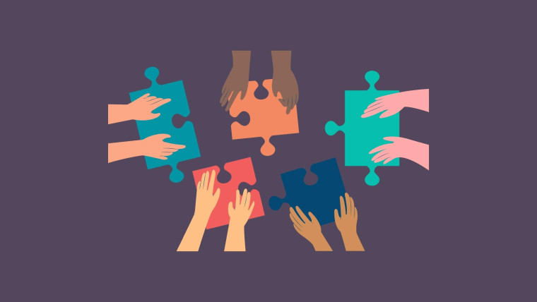 An illustration of multiple hands from different people assembling colorful puzzle pieces together.