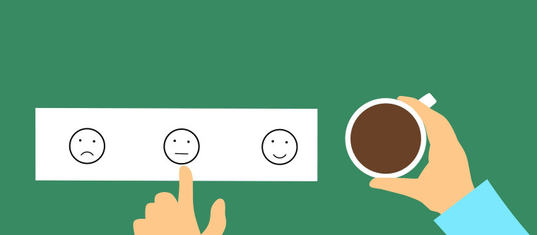 An illustration of a hand pointing at the neutral option on a three-face sentiment rating card.