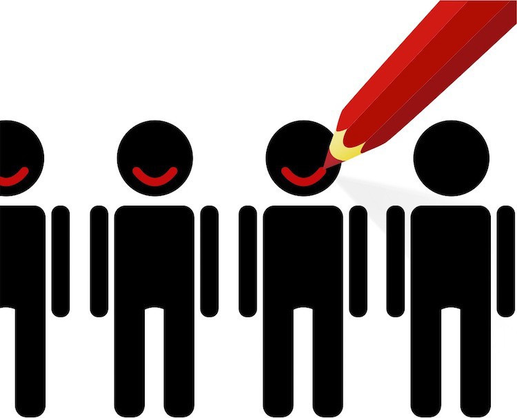 A red pencil drawing a smile onto one of a row of black stick-figure people.