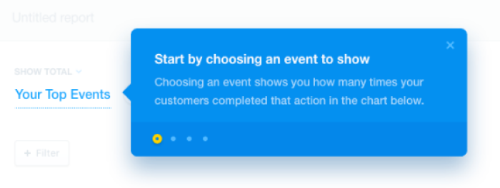 A product tour step overlaying an analytics dashboard, prompting users to choose an event to track