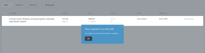 An in-app popup on Quartzy's inventory request screen confirming a submitted request and noting that a status update email will follow.