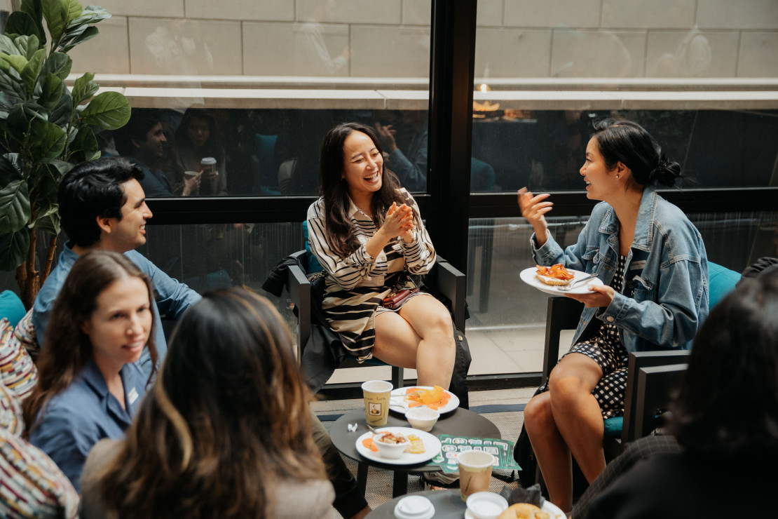 Attendees chatting and socializing at a Chameleon in-person event