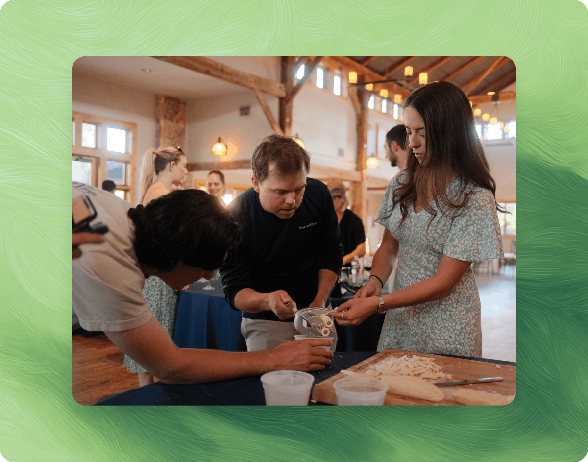 Chameleon team members collaborating on a hands-on group activity at an off-site event.