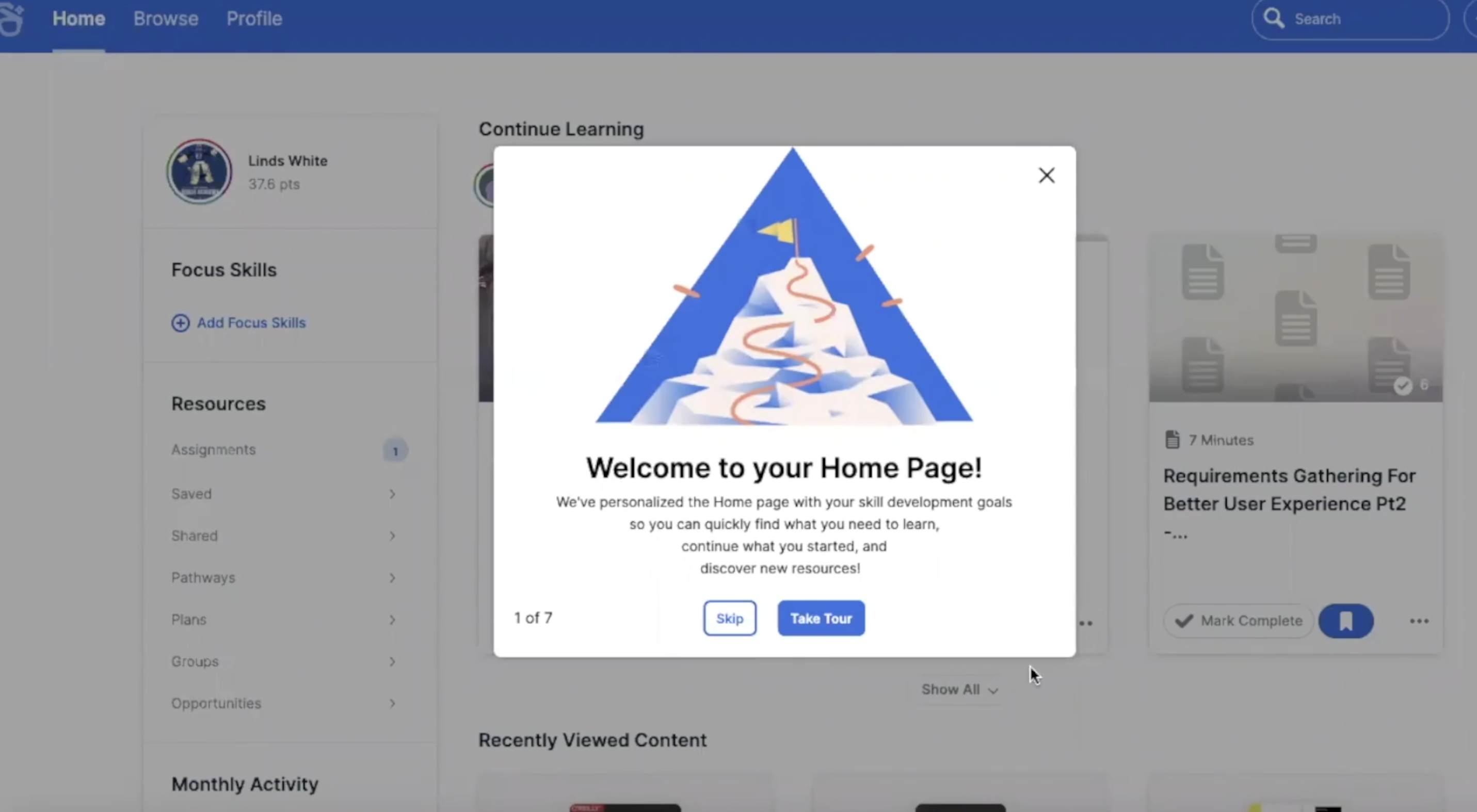 The opening step of a Degreed onboarding product tour, with a mountain-summit illustration and options to skip or take the tour.