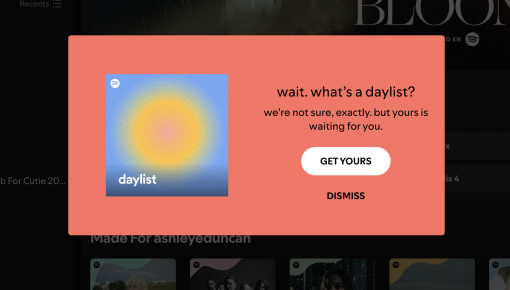 A Spotify modal announcing a new personalized playlist feature, with playlist cover art alongside a curiosity-driven headline and a 'Get Yours' CTA.