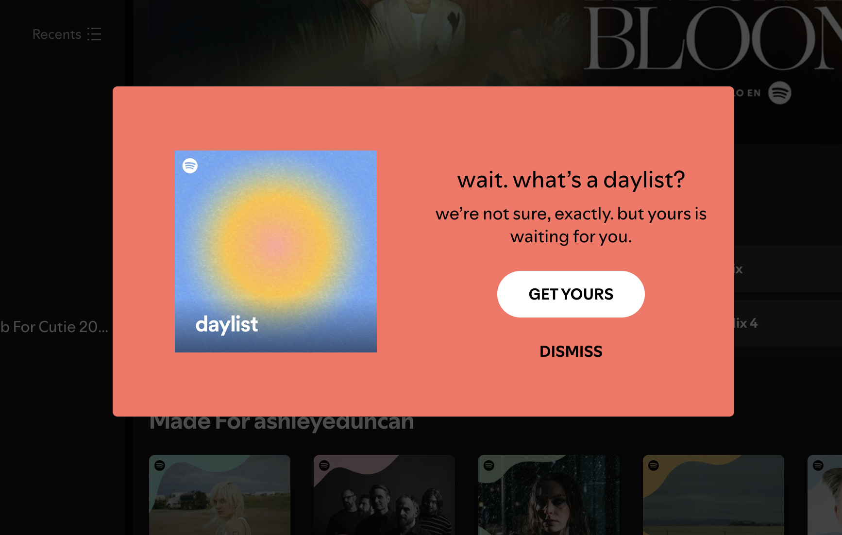 A Spotify modal announcing a new personalized playlist feature, with playlist cover art alongside a curiosity-driven headline and a 'Get Yours' CTA.