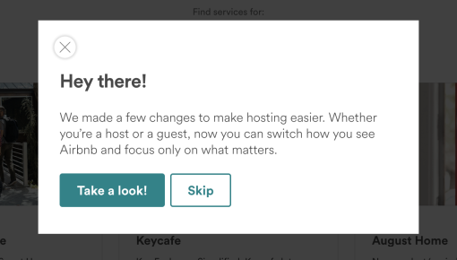 An in-app modal on Airbnb's website announcing a navigation and layout redesign, with 'Take a look!' and 'Skip' buttons.